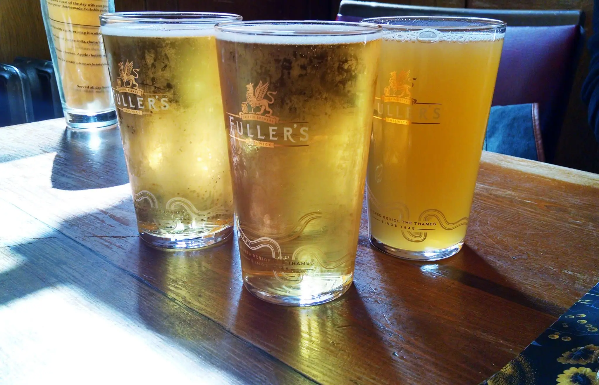 Two glasses of golden cider — the drink you'll find in every pub in Cornwall.