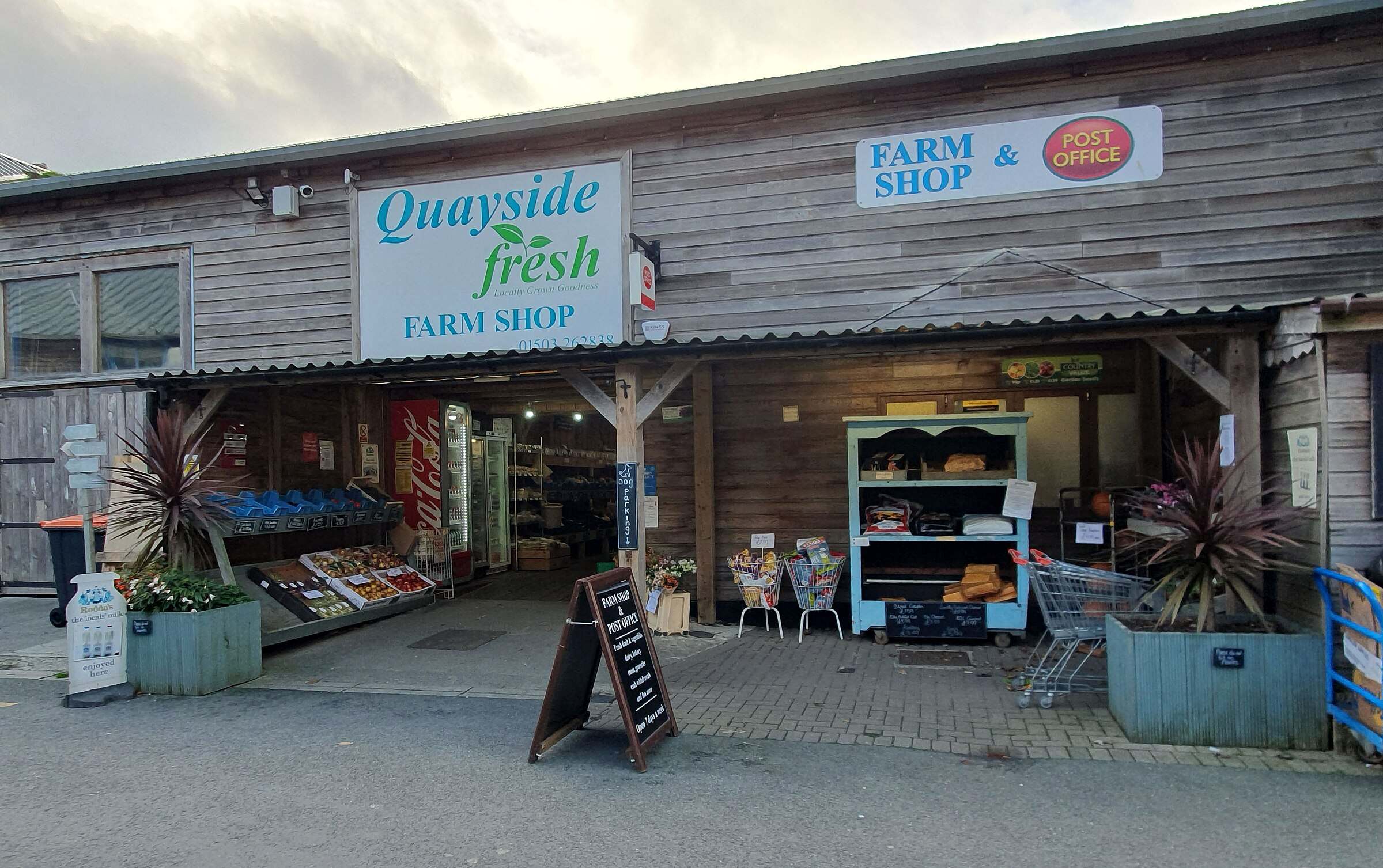 A Cornish farm shop interior with shelves of local jams, chutneys and baked goods.