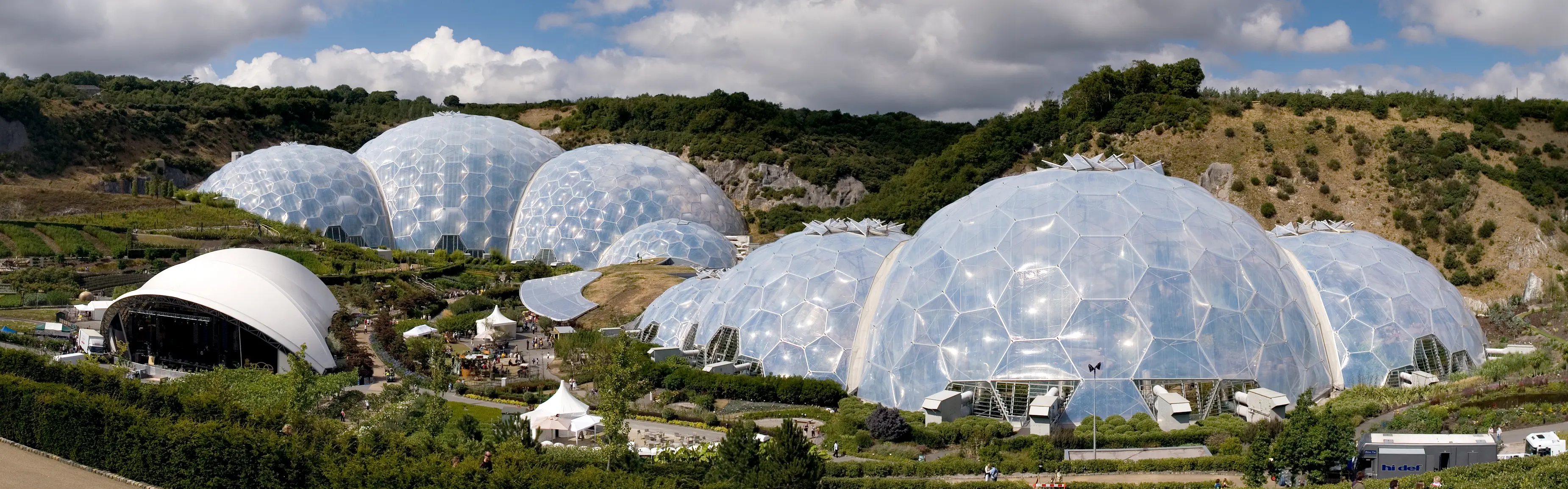 The Eden Project's biomes — vast geodesic domes nestled in a former clay pit, with tropical and Mediterranean gardens inside.