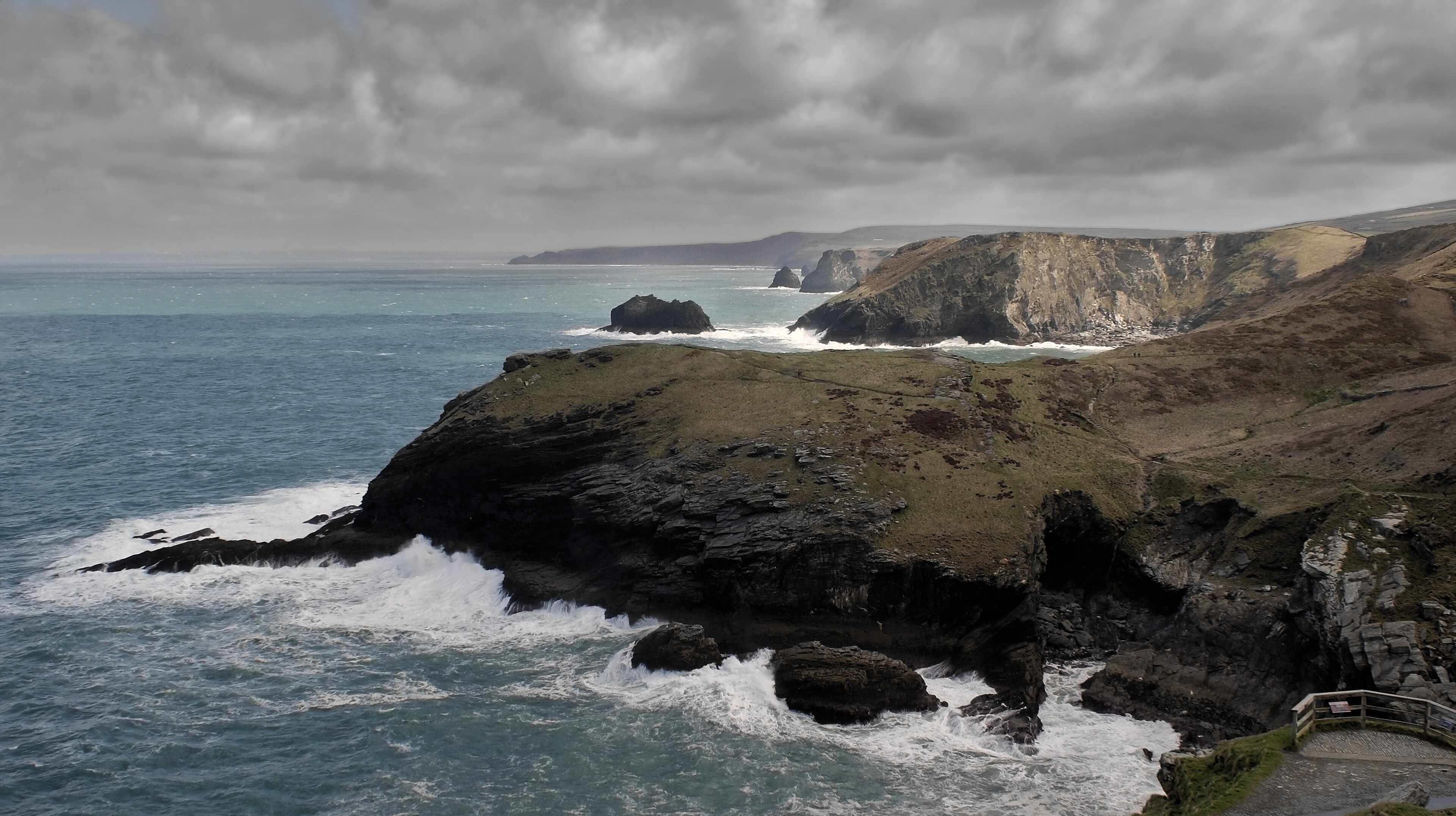 A panoramic view of the Cornish coastline — turquoise water, dramatic cliffs, and the kind of light that makes you stop the car.