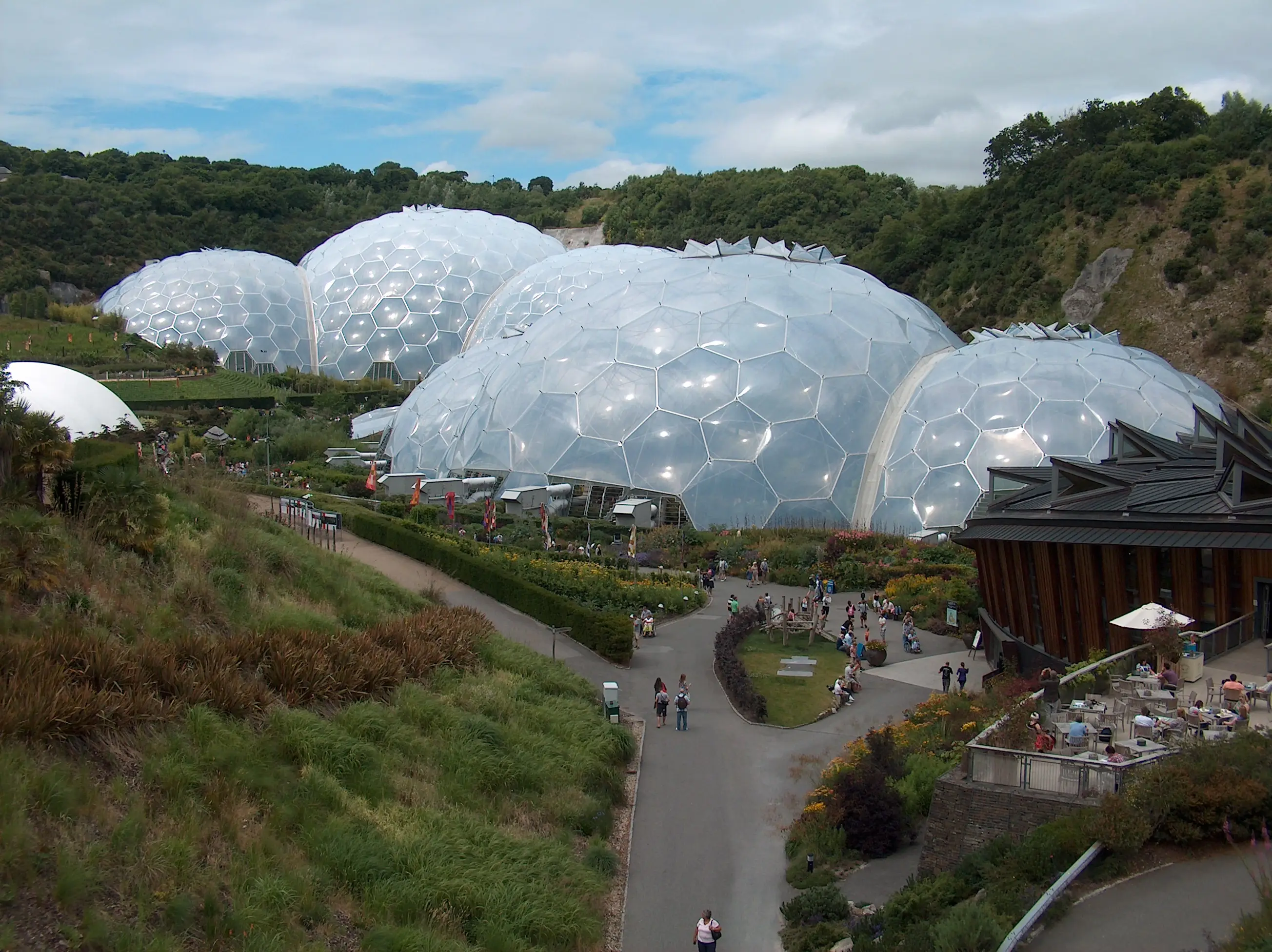 The Eden Project biomes — view across landscaped gardens toward the geodesic domes.