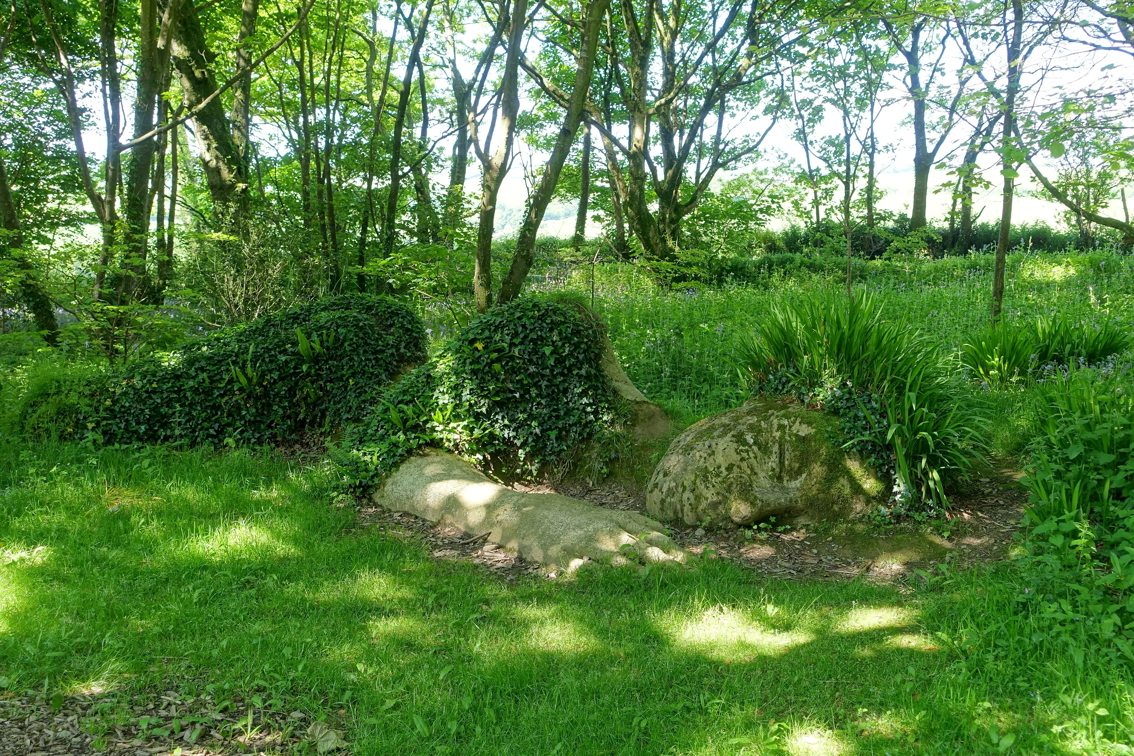 The Lost Gardens of Heligan — the Mud Maid sculpture, a sleeping figure built from earth and living plants.