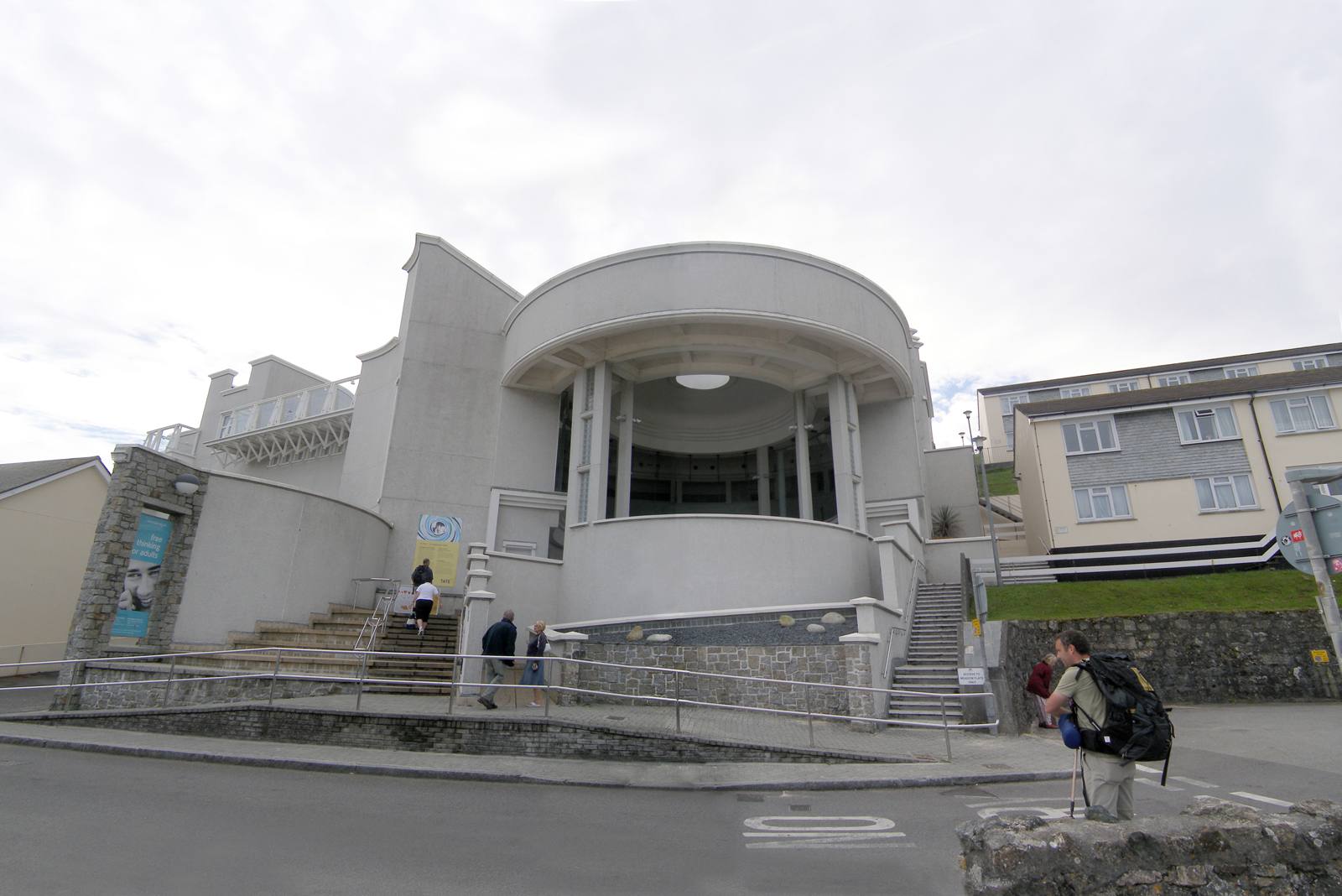 The interior of Tate St Ives on a rainy day — the curved gallery space and the windows opening onto Porthmeor below.