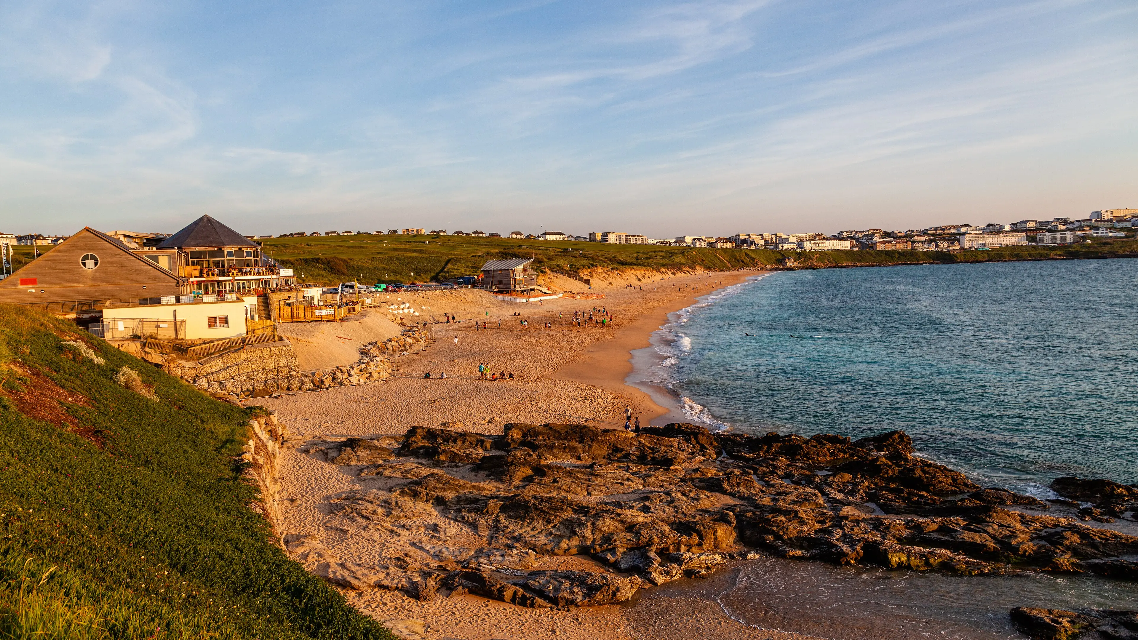 Fistral Beach in Newquay — Cornwall's most famous surf beach, with lines of whitewash rolling towards the shore.
