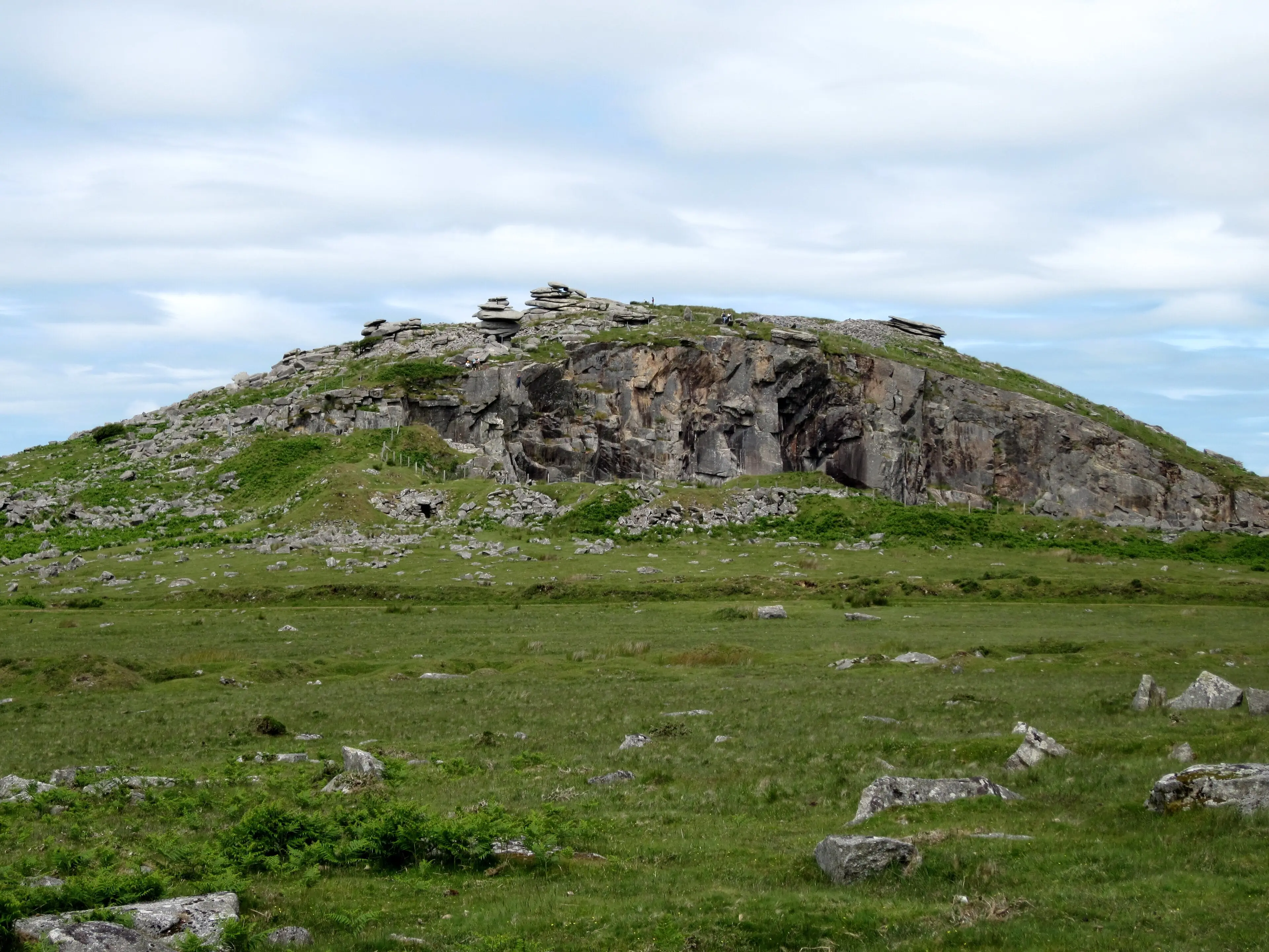 The Cheesewring on Bodmin Moor — a natural granite stack on the open moorland under a wide sky.