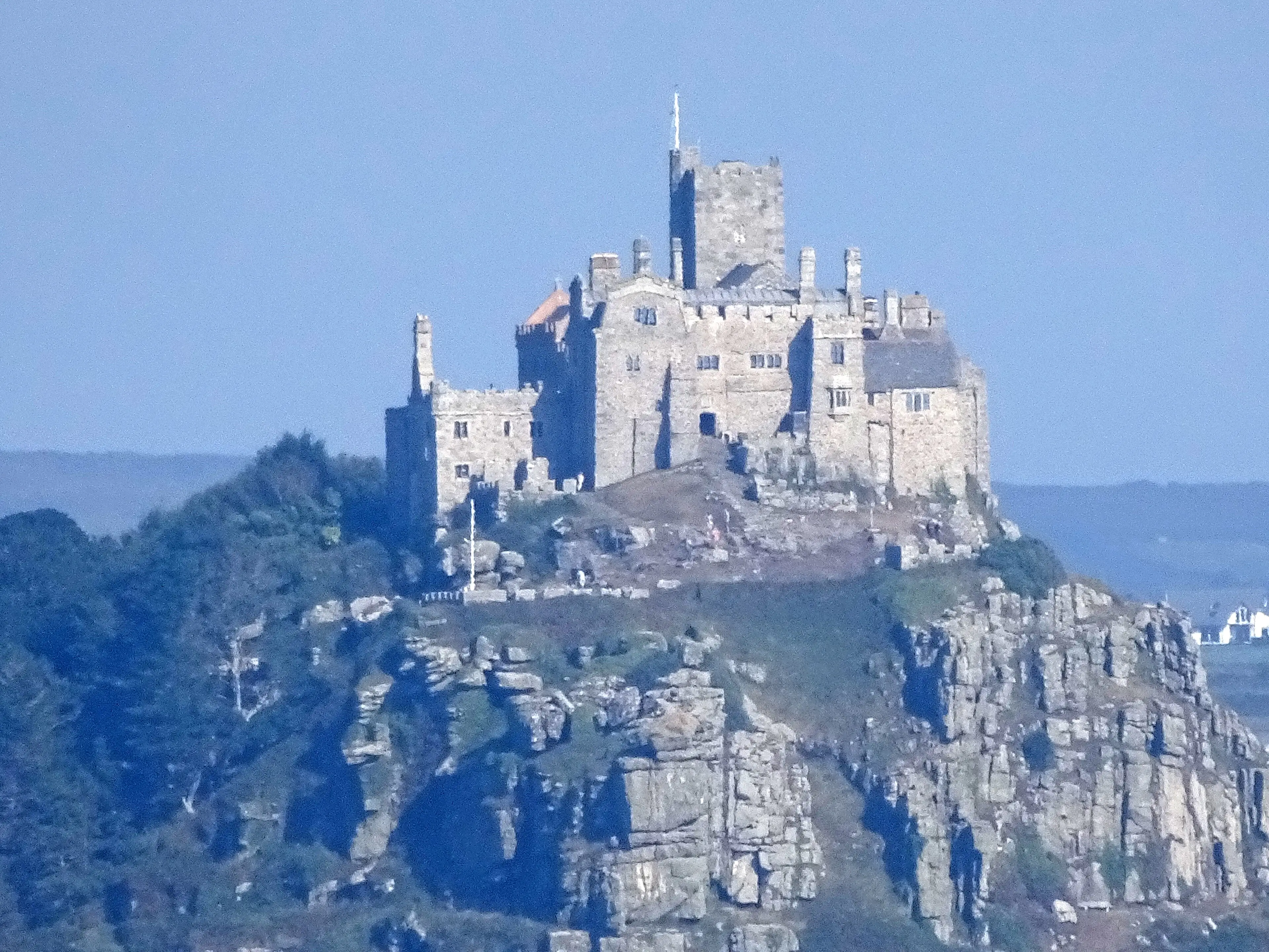 St Michael's Mount rising from Mount's Bay — the tidal island and castle against a dramatic sky.